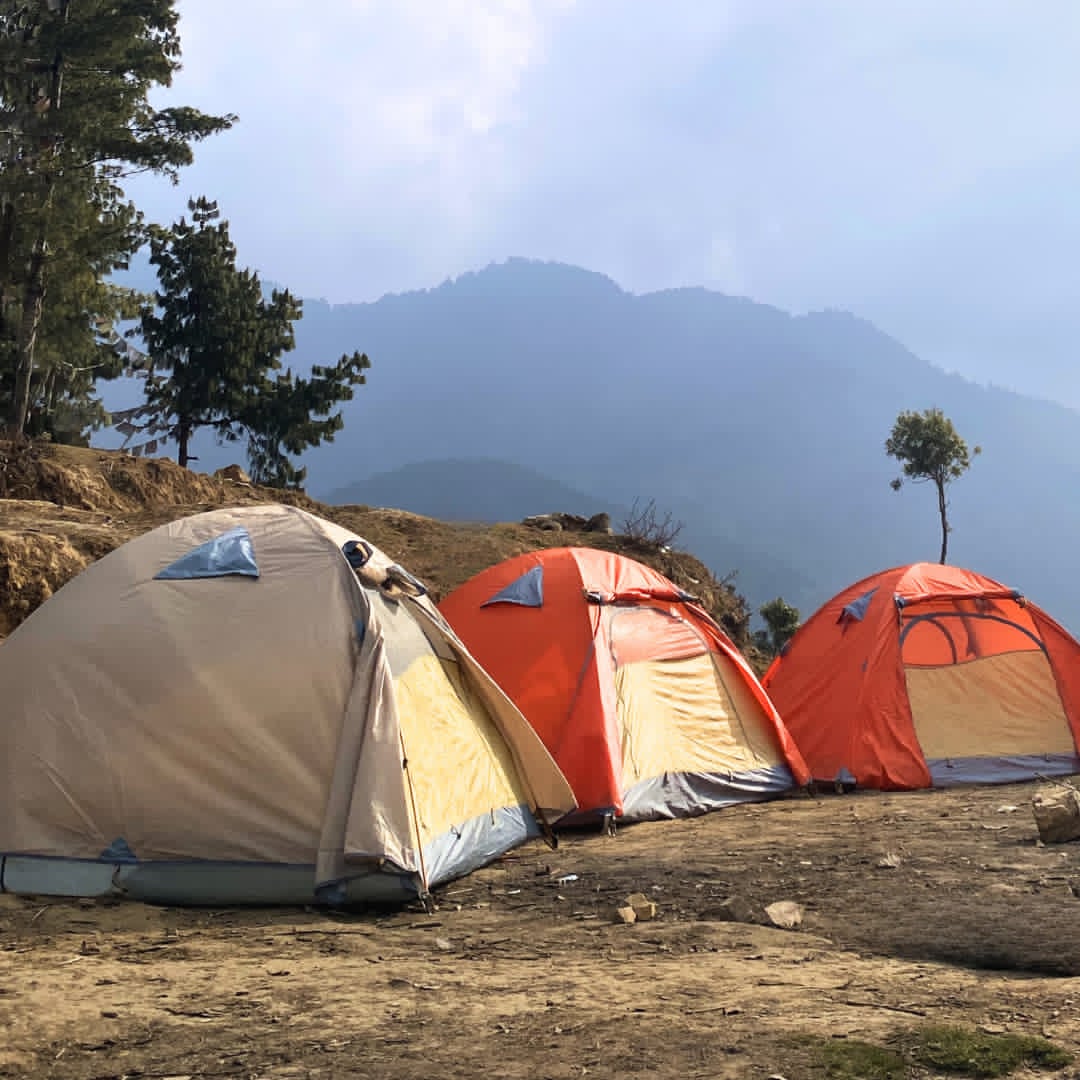 Camping tent set up in the mountains